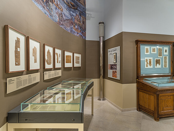 View of the papyrus museum. The objects are framed or displayed in showcases.